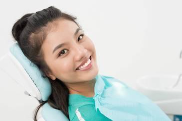 restorative dentistry dedham | woman at dentist office