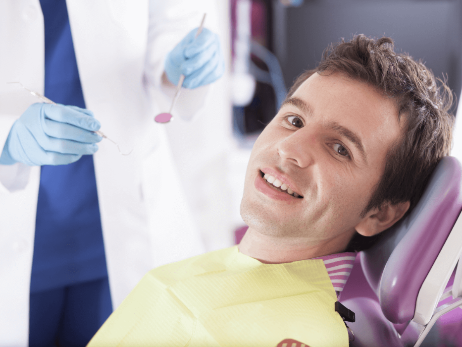 cosmetic dentist dedham | man at dentist