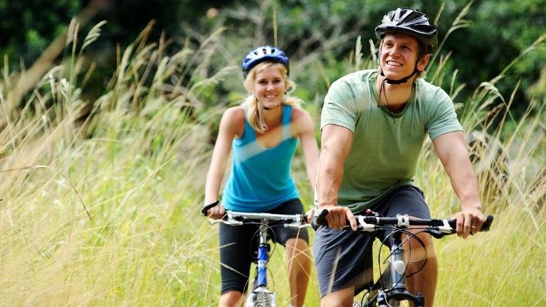 A couple riding bikes