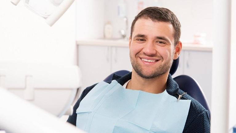 man at the dentist | dental emergency dedham, ma