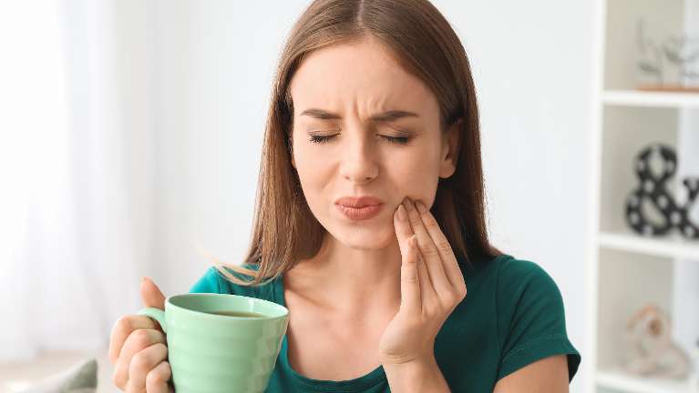 root canal dedham | Woman with toothache