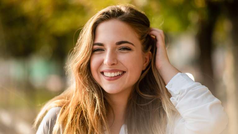 tooth replacement dedham | woman smiling