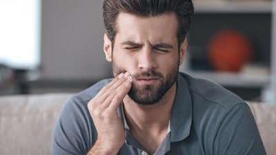 root canal dedham, ma | man with toothache