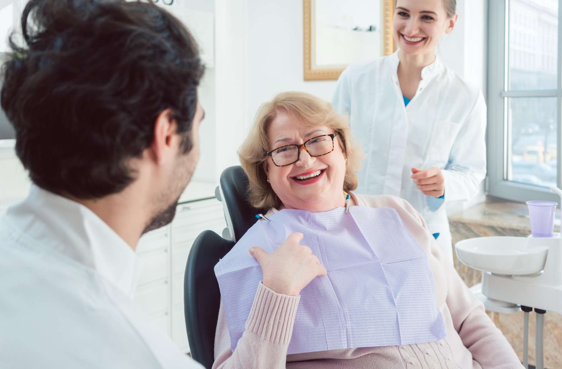 dental crowns dedham | woman at dentist